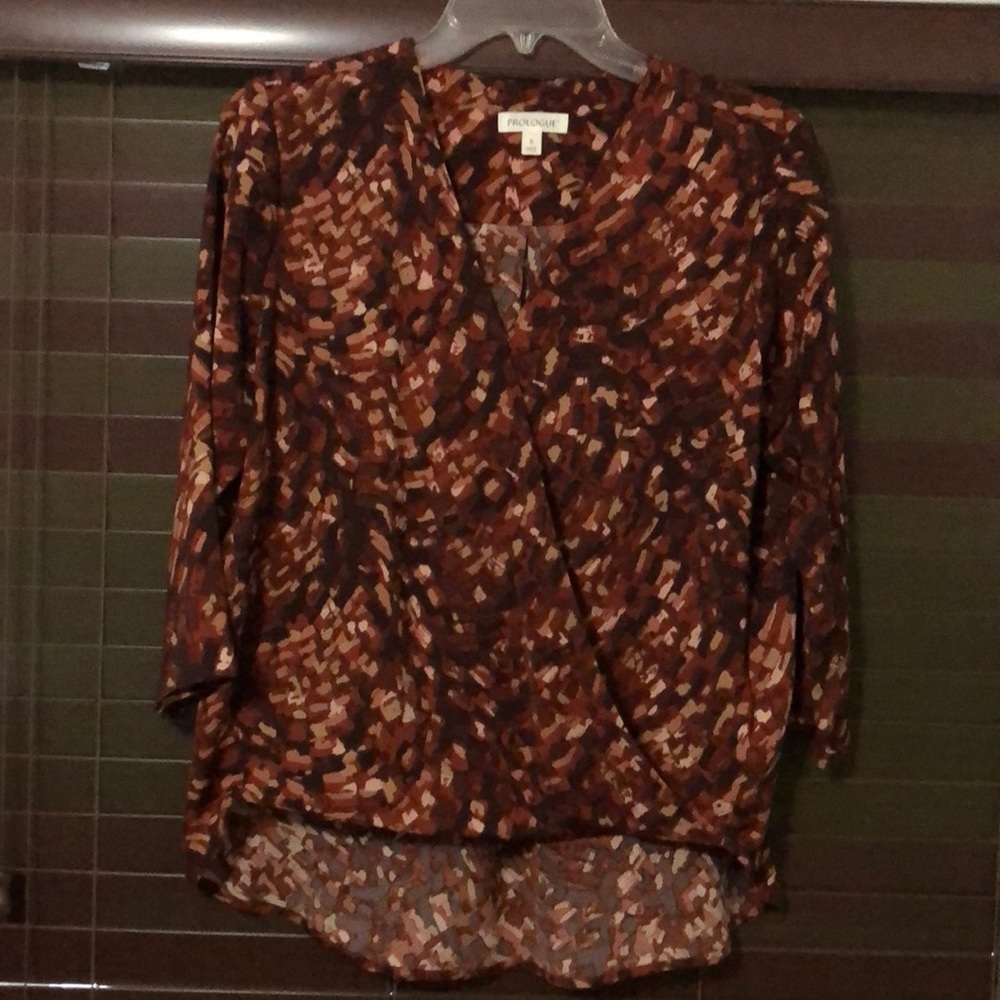 3/4 length sleeve blouse, a little longer in the back 100% polyester